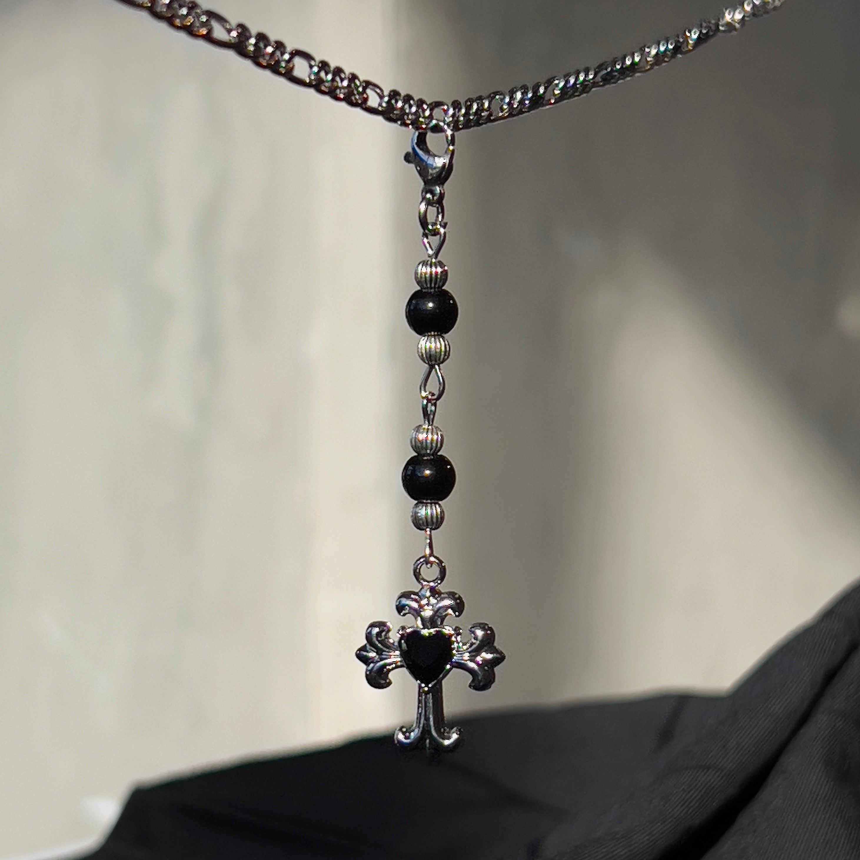 black cross chain charm