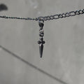 "back in black" cross charm